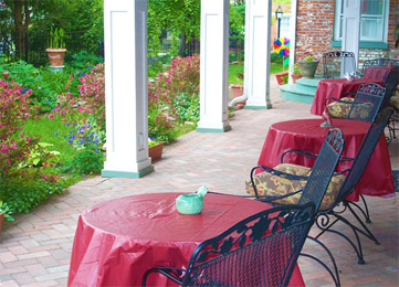 Lower porch on southern side of Azalea Manor Bed and Breakfast  in Indiana’s Madison Historic District, downtown Madison Indiana 47250